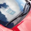 Car wipers on the red car karta parkingowa